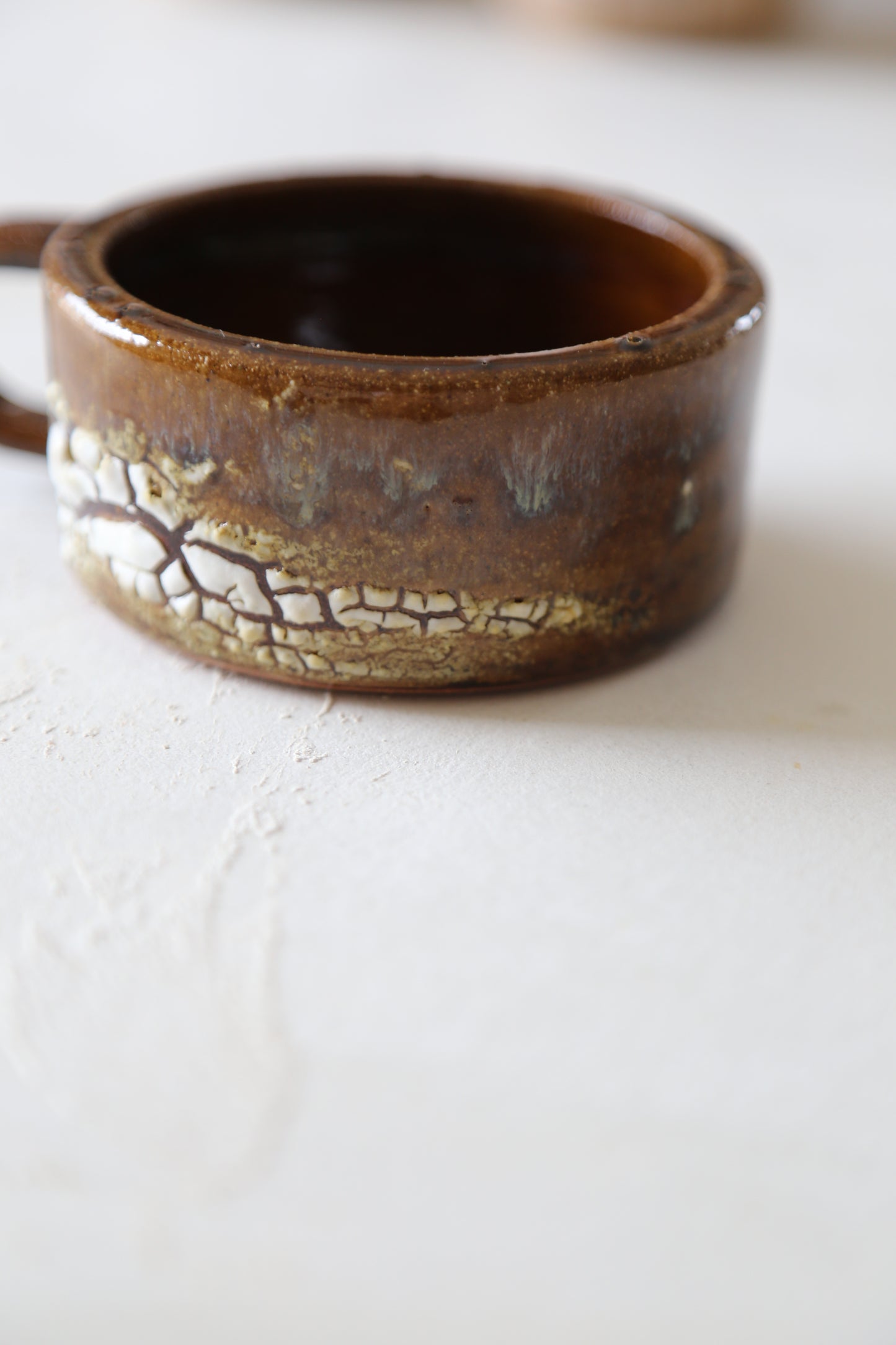 Cracked earth mug / dirty dishes