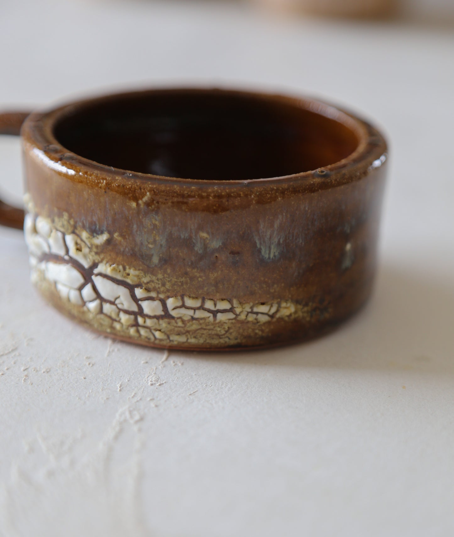 Cracked earth mug / dirty dishes