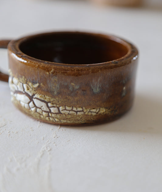 Cracked earth mug / dirty dishes